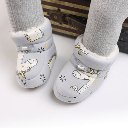 Chaussure bébé blanche avec motif animal et chaussettes grises