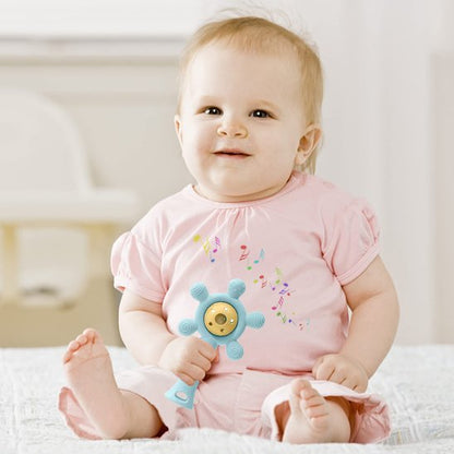 Hochet bébé ventouse coloré manipulé par un bébé assis pour développer la coordination