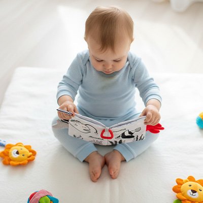 Livre bébé en tissu nomade pour les sorties, stimule l’éveil et la motricité